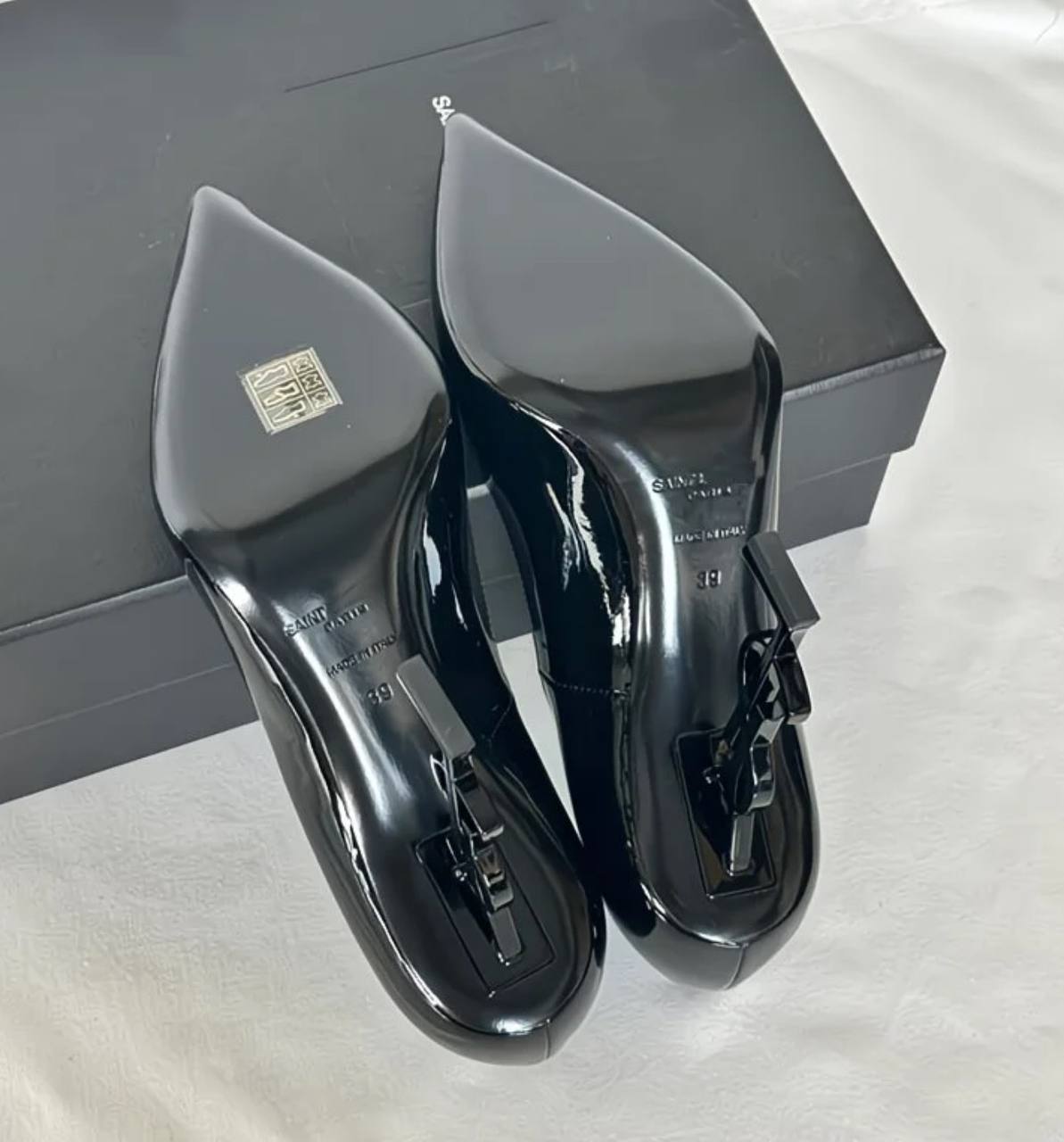 This shoe is a luxurious high heel from Saint Laurent (YSL)
