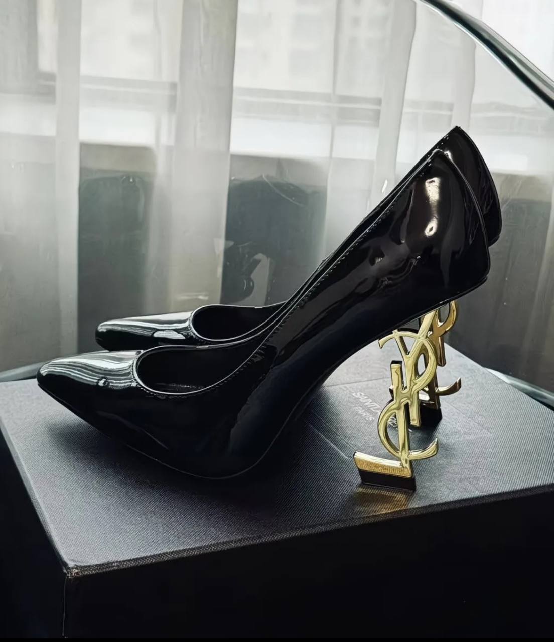 This shoe is a luxurious high heel from Saint Laurent (YSL)