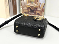 Dior mini handbag in Black-Gold lambskin.