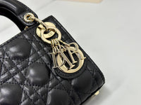 Dior mini handbag in Black-Gold lambskin.