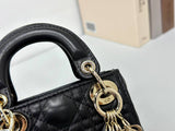 Dior mini handbag in Black-Gold lambskin.