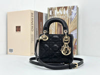 Dior mini handbag in Black-Gold lambskin.